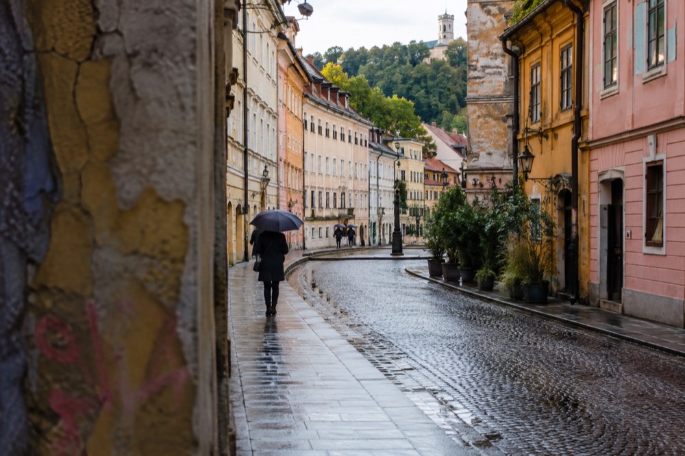 Colourful painted facades and paint-covered walls in an autonomous cultural quarter in Ljubljana