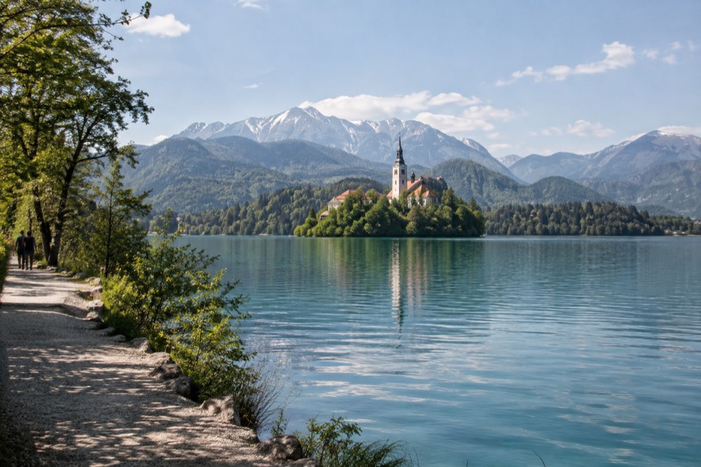 Bled Island church across still water from the eastern lake path