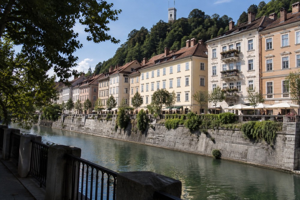 View across the Ljubljanica river to the coloured facades of the Ljubljana Old Town