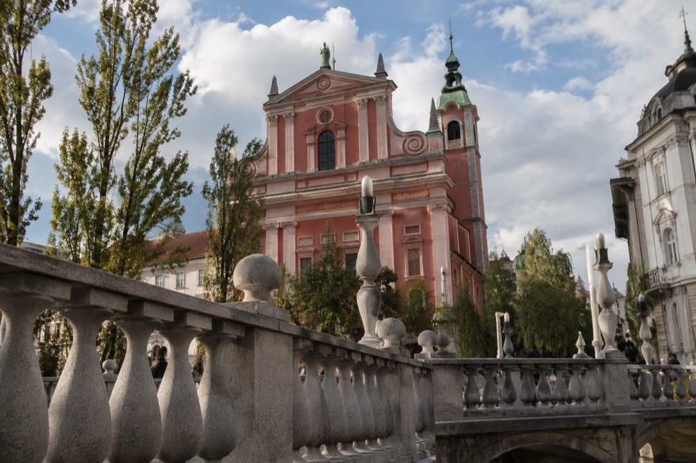The facade of the Franciscan Church seen from the Triple Bridge across the Ljubljanica river