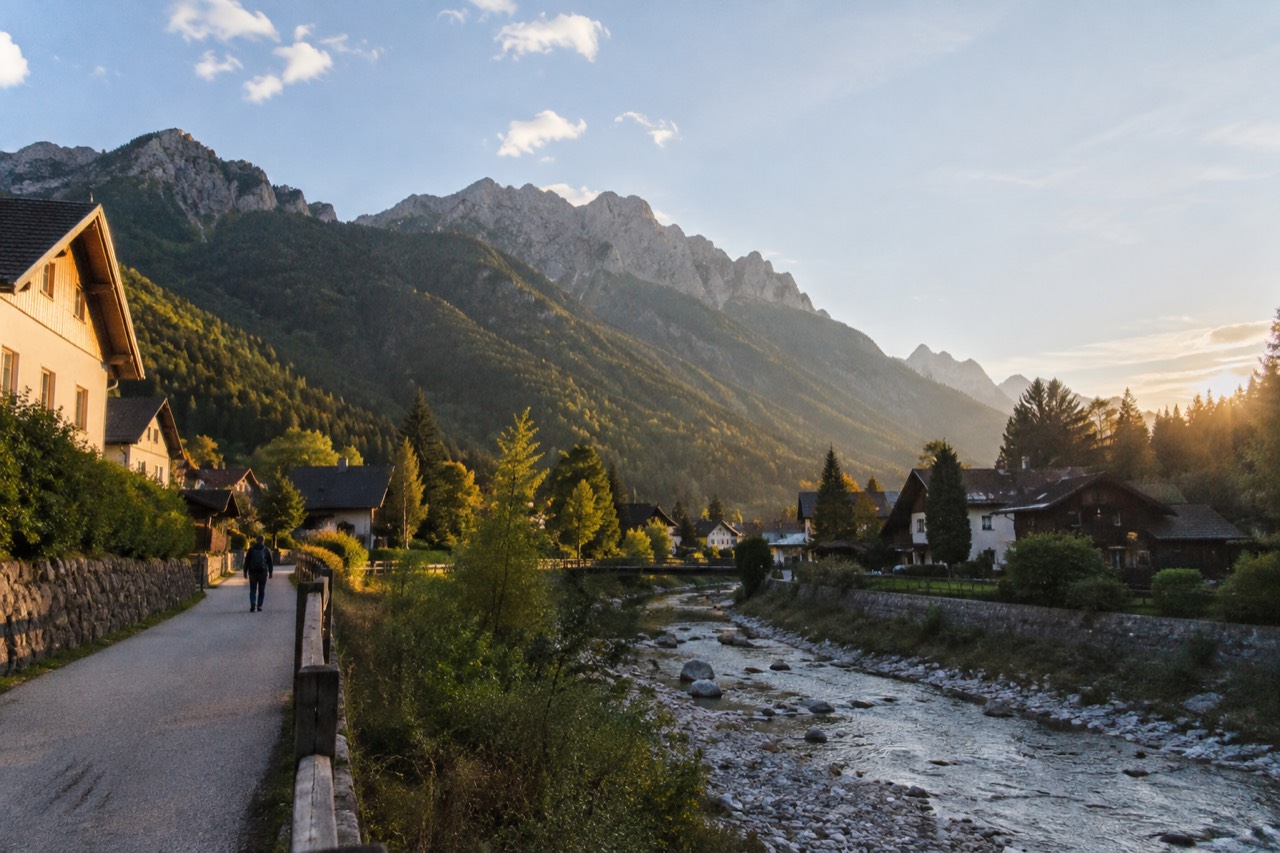 Alpine village of Kranjska Gora beneath green mountains at the head of a valley