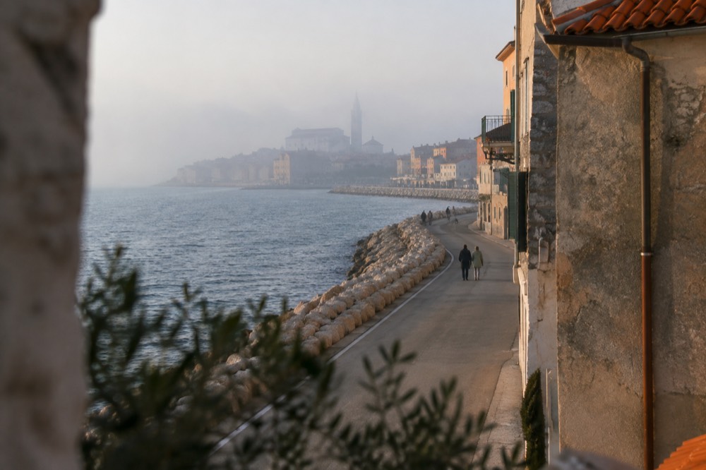 Coastal road curving past Izola towards Piran with the Adriatic on the left