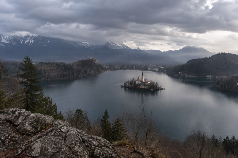 Rain clouds gathering over the wooded hills above Lake Bled