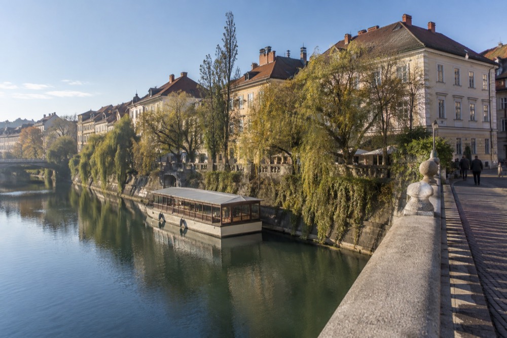 A river boat moored along the Ljubljanica near the old city centre