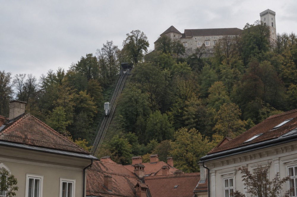The funicular rising toward Ljubljana Castle above the old town rooftops