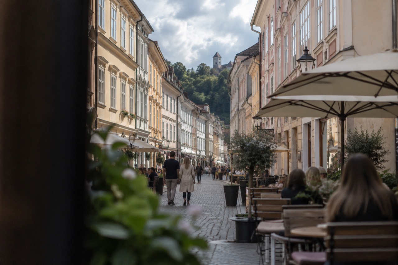 Café tables and pastel facades along the pedestrianised streets of central Ljubljana