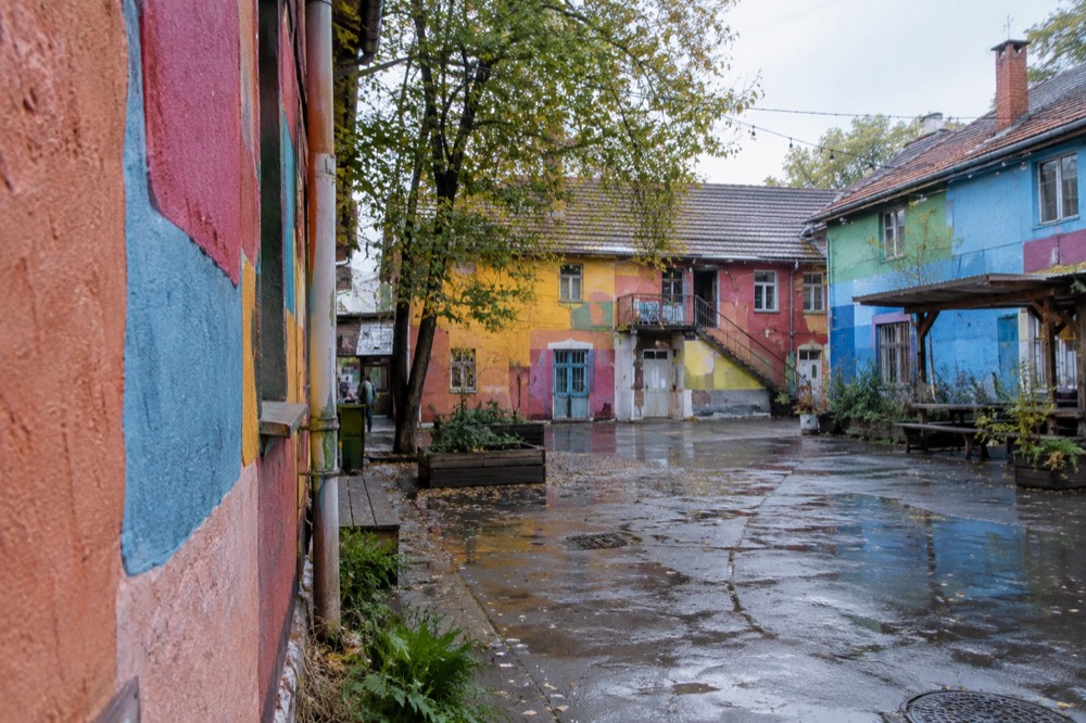 Colourful painted facades and paint-covered walls in the Metelkova quarter